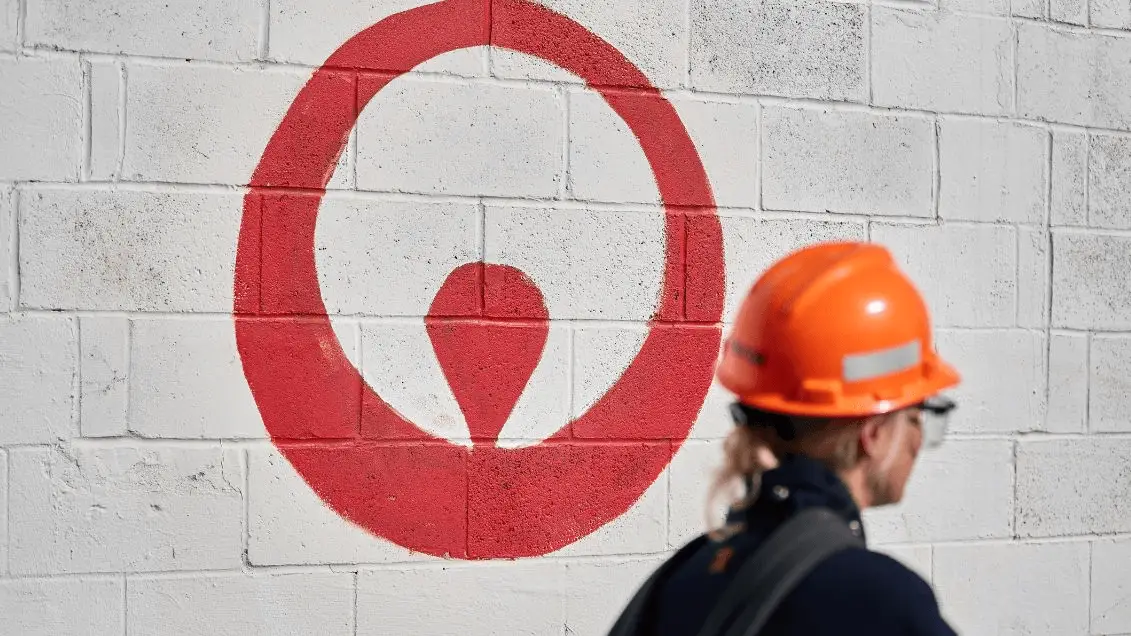 Image of female worker with Veolia logo in background