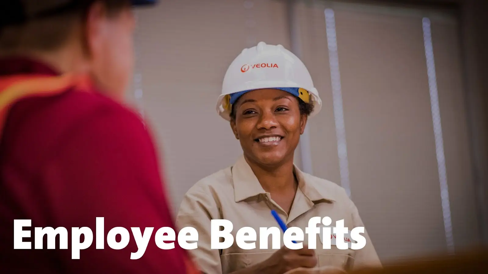 Female worker with Employee Benefits verbiage