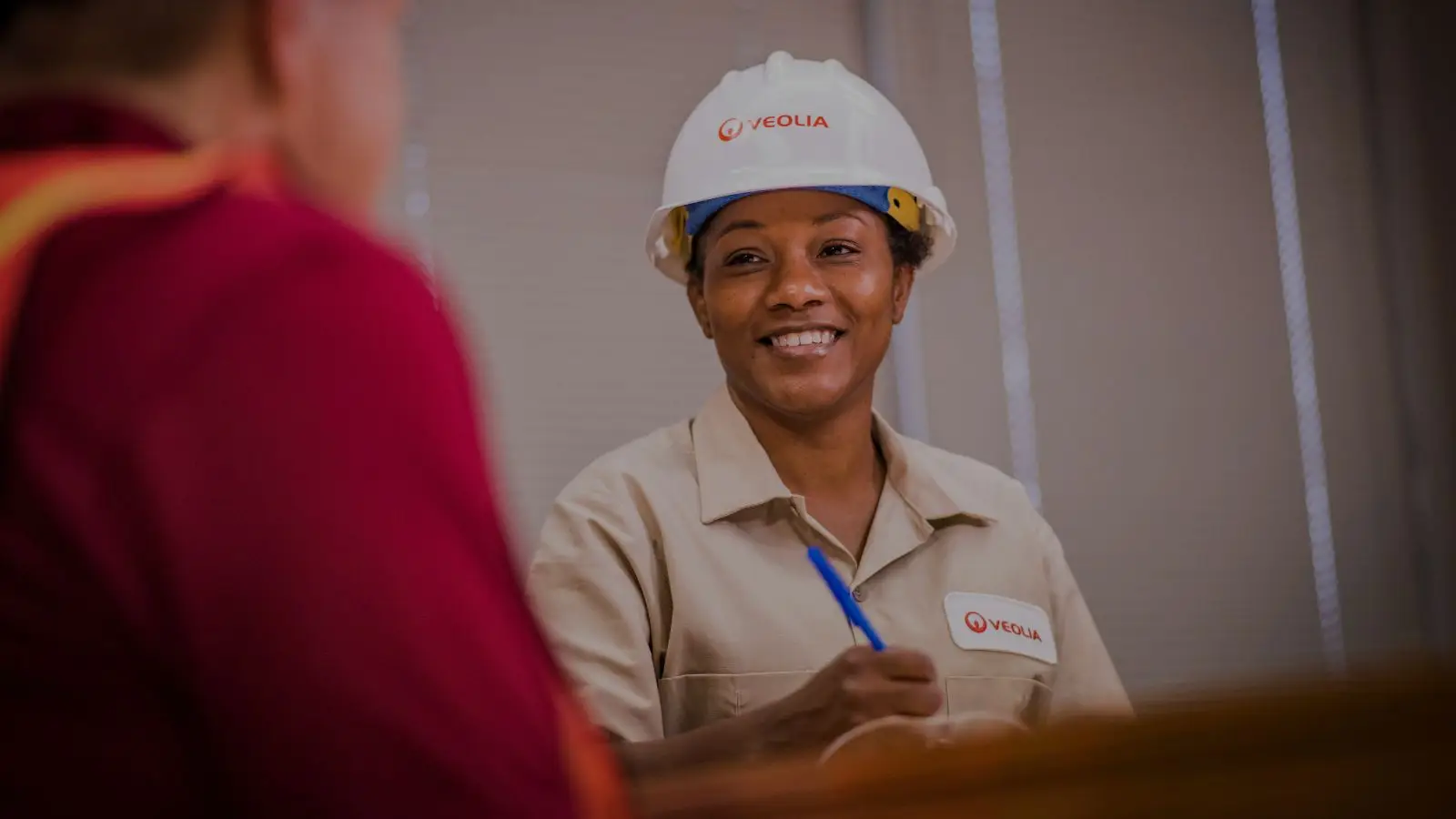 Female worker with Employee Benefits verbiage