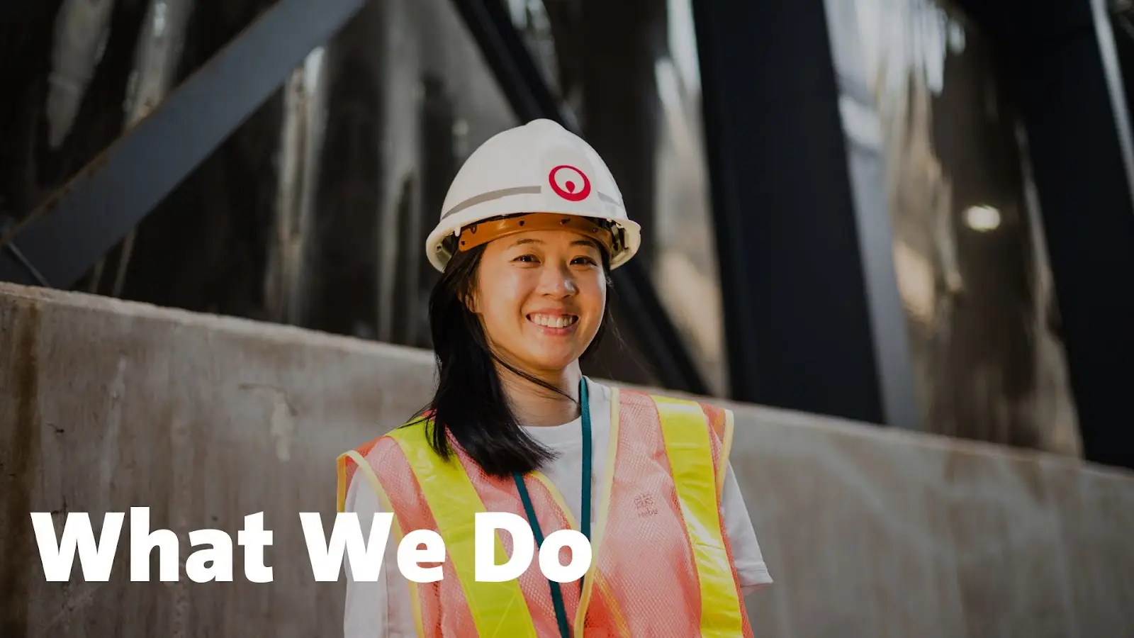 Female worker with What We Do verbiage